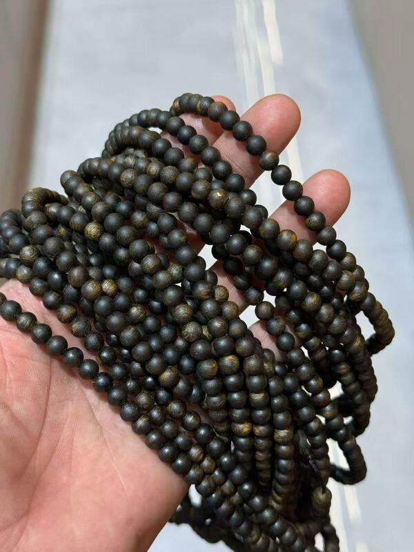 Quality Dark Brown With Natural Wood Grain Natural Agarwood Rosary Durable Resistant To Wear Ideal For Meditation Prayer And Spiritual factory